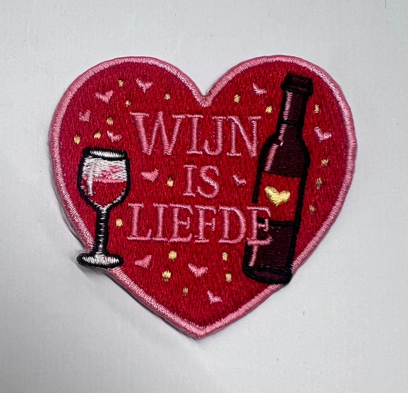 Wijn is liefde embleem